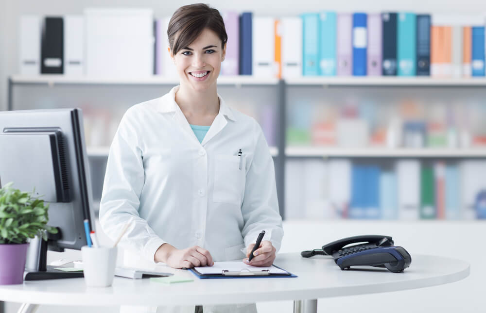 Doctor at checkin desk at medical office