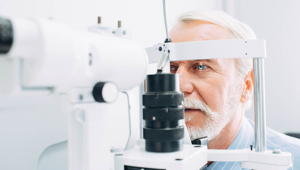 Senior man getting an eye exam