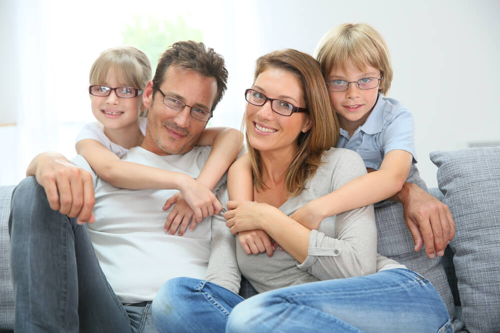 Happy family all wearing glasses